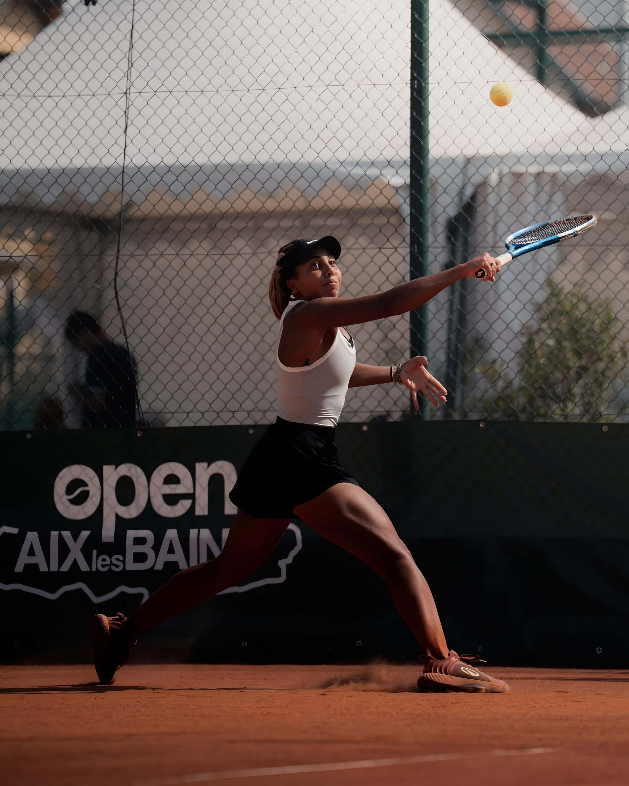 Sophia hitting a backhand at the Aix-les-Bains Open